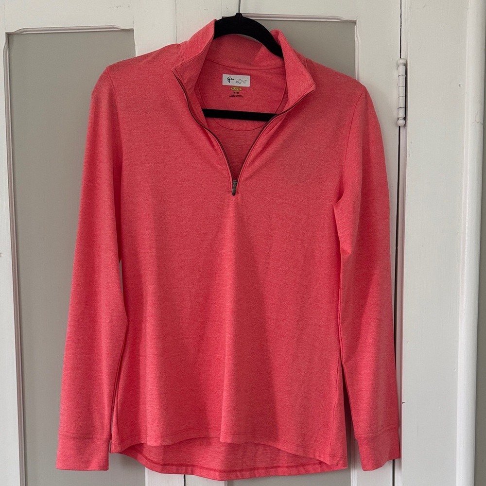 Women’s Greg Norman 1/4 zip golf shirt. New with tags. Size medium.